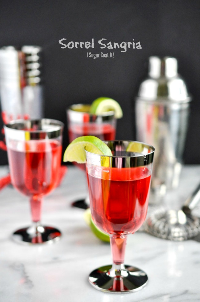 Silver-rimmed glasses with jewel red sorrel sangria | I Sugar Coat It