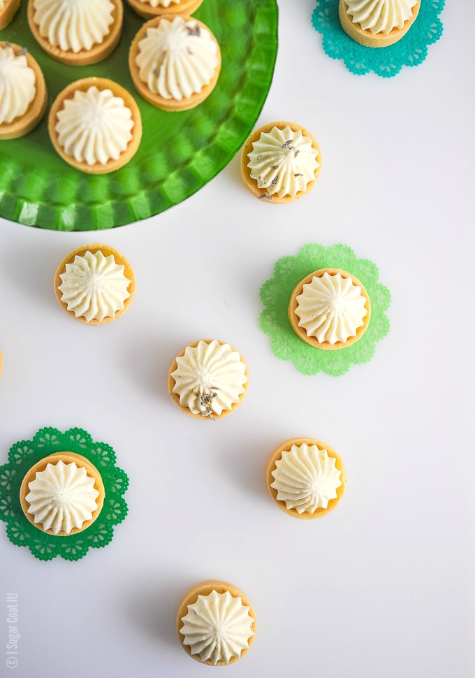 These mouthwatering Lemon Lavender Coconut Mousse Mini Tarts are summer in bite-size sweet pastry, filled with fresh curd and topped with a dreamy mousse!