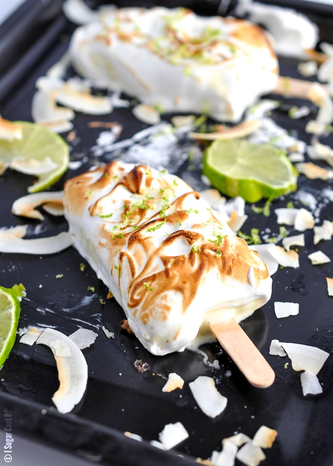 Creamy, tart and sweet Key Lime Curd Meringue Popsicles clad in lightly toasted meringue - basically, a pie on a stick!