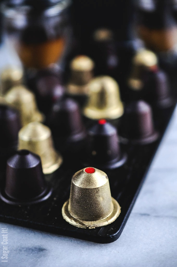 A coffee lover's dream, these dark chocolate nespresso-like pods are filled with a luxurious white chocolate espresso caramelized cacao nib ganache.